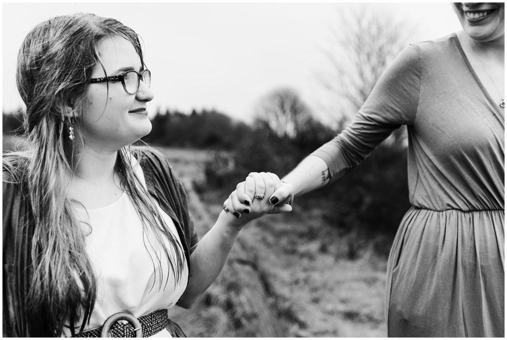 Discovery Park engagement session, LGBTQ couple holding hands