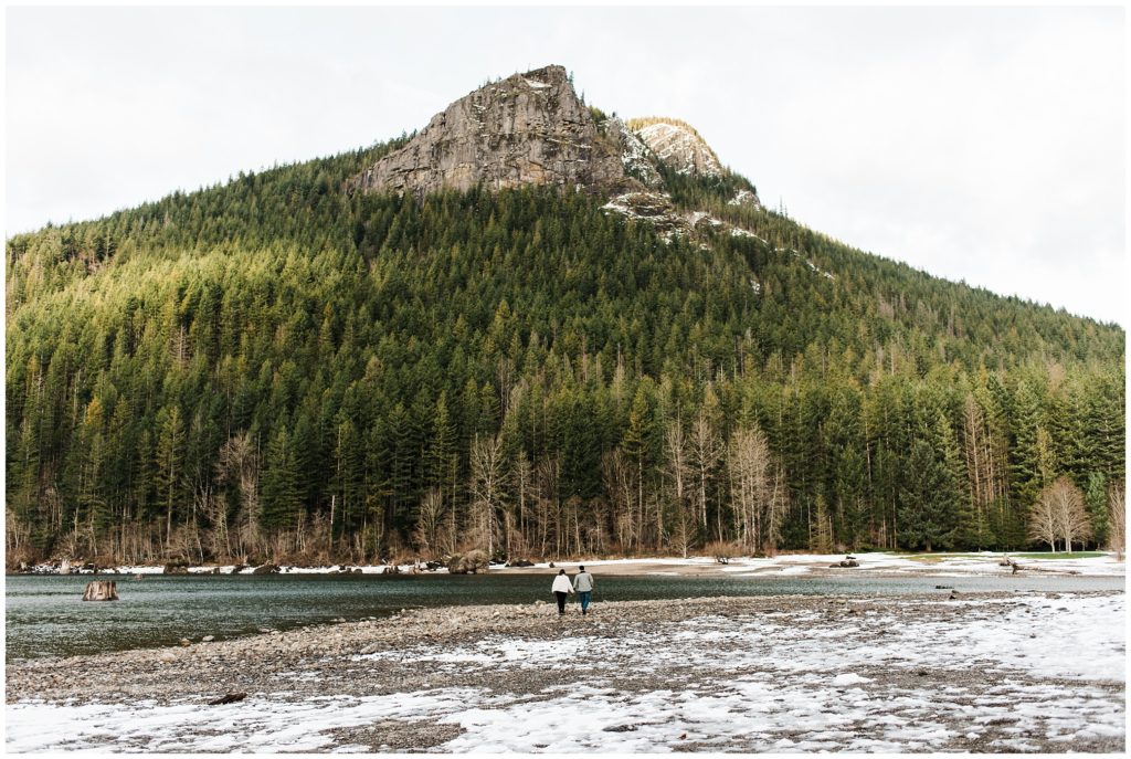 Couple walking along Rattlesnake Lake for their Seattle engagement photos