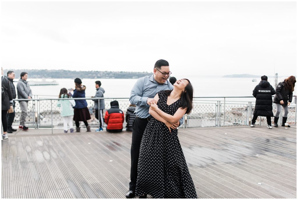 Pike Place engagement session ideas, engaged couple dancing