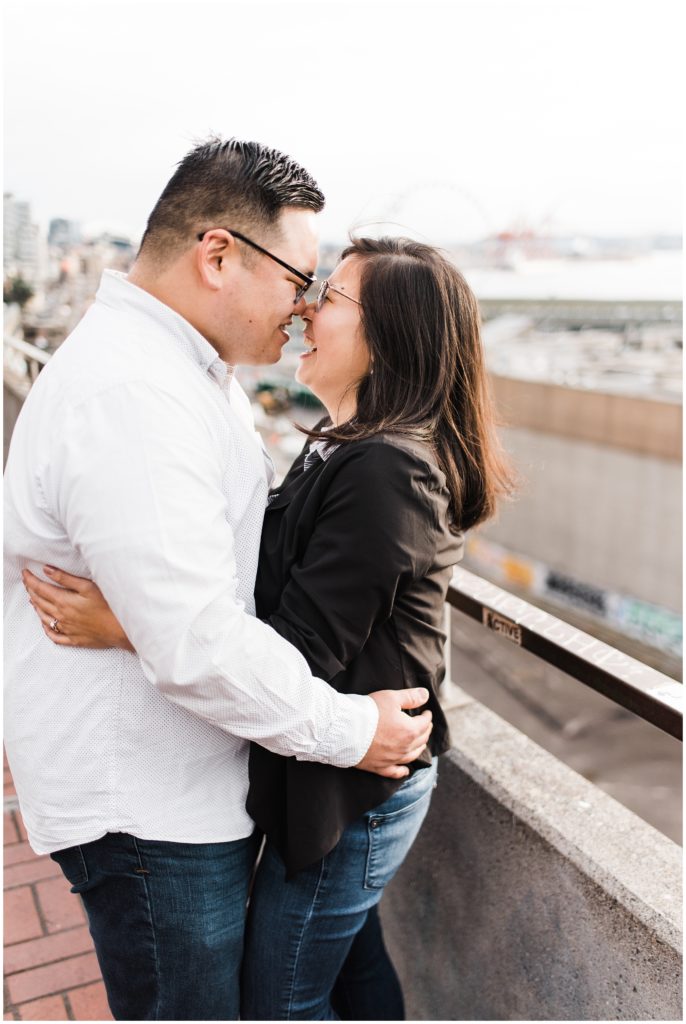 Pike Place engagement session ideas, couple hugging and touching noses
