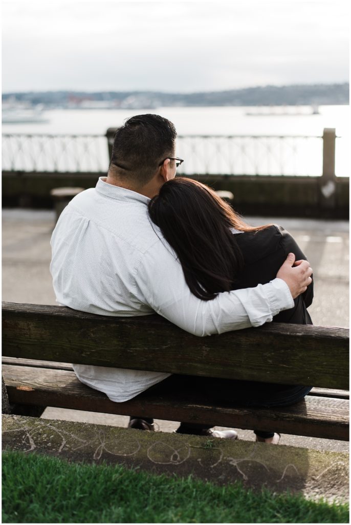 Pike Place engagement session ideas, couple staring out at the water