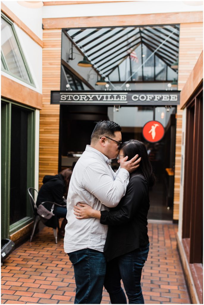 Pike Place engagement session ideas, couple kissing outside Storyville Coffee
