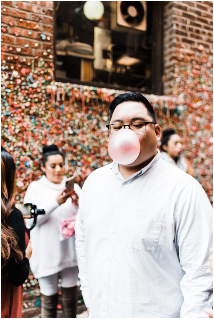 Pike Place engagement session ideas, blowing bubbles at the gum wall