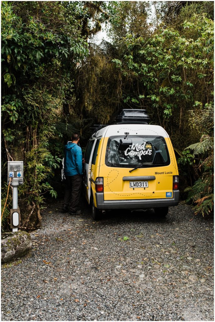 How to travel New Zealand in a campervan, staying at a tropical holiday park on the west coast